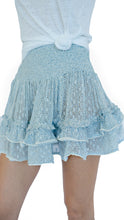 Sunday St Tropez smocked ruffle mini skirt  in blue with flower print